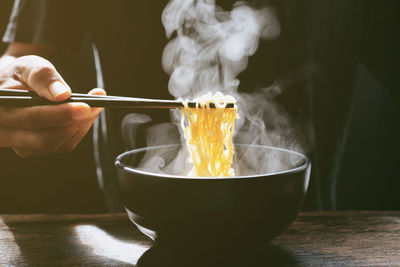 Close-up of person preparing food in kitchen