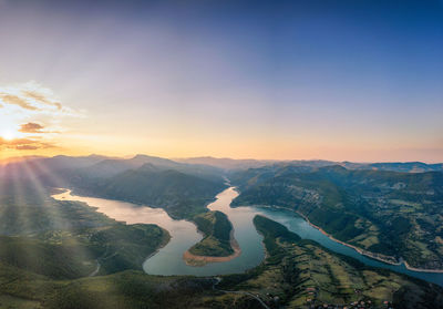 Aerial view of landscape against sky during sunset