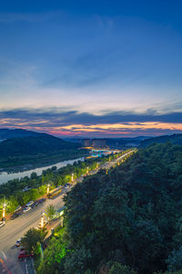 High angle view of city against sky at sunset