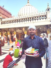 Portrait of smiling man having food