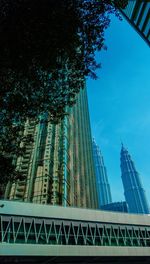 Low angle view of modern building against blue sky