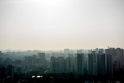 Cityscape against sky during sunset