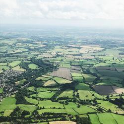 Aerial view of agricultural field against sky