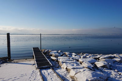 Scenic view of sea against sky during winter