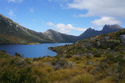 Scenic view of lake and mountains against sky