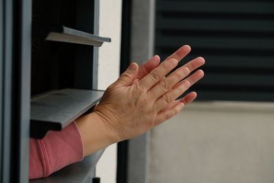 Close-up of hand on book