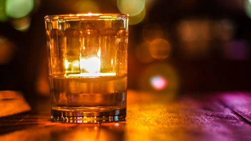 Close-up of beer glass on table