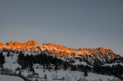 Scenic view of snowcapped mountains against clear sky