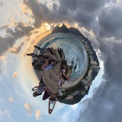 Digital composite image of people in water against sky