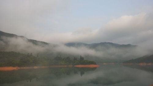 Scenic view of lake with mountains in background