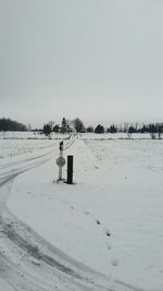 Scenic view of snow field against clear sky