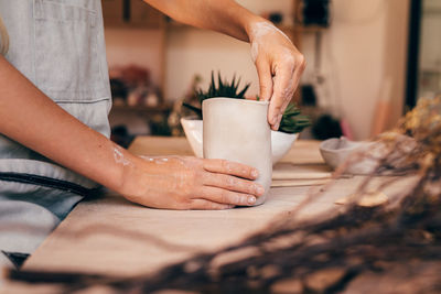 Midsection of woman preparing food