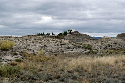 Panoramic view of landscape against cloudy sky