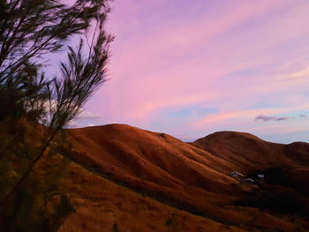 Scenic view of landscape against sky during sunset