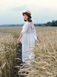 Young woman standing on field