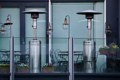 Potted plants on street light in city