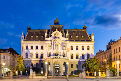 Facade of historic building at night