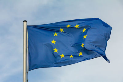 Low angle view of flag against sky