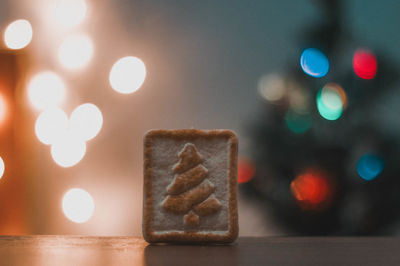 Close-up of illuminated christmas lights on table