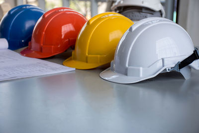 Close-up of hardhats on table