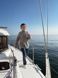 Portrait of boy sitting on boat