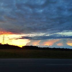 Scenic view of landscape against cloudy sky