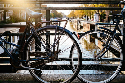 Close-up of bicycle wheel in city