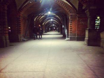 Empty illuminated corridor at night