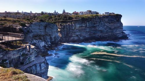 Scenic view of rock formations in sea