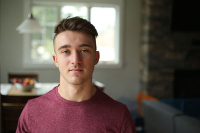 Portrait of young man at home