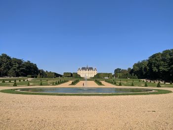 View of castle against clear blue sky