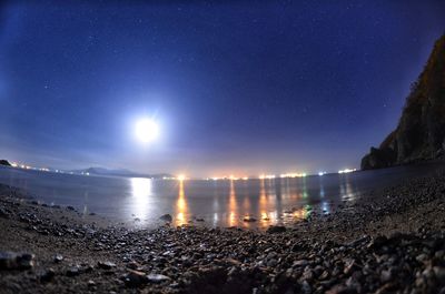 Scenic view of sea against sky at night