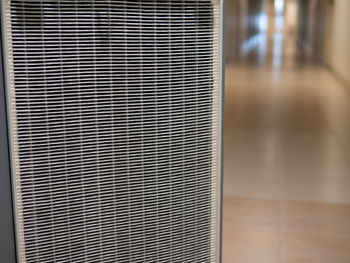 Close-up of metal grate on floor in building