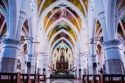 Interior of cathedral against buildings