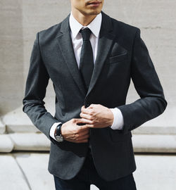 Elegant male businessman outfit detail in the city