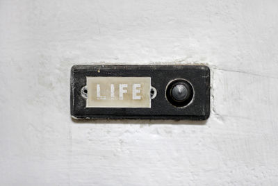 Close-up of telephone booth on wall