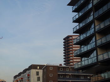 Low angle view of buildings in city against sky