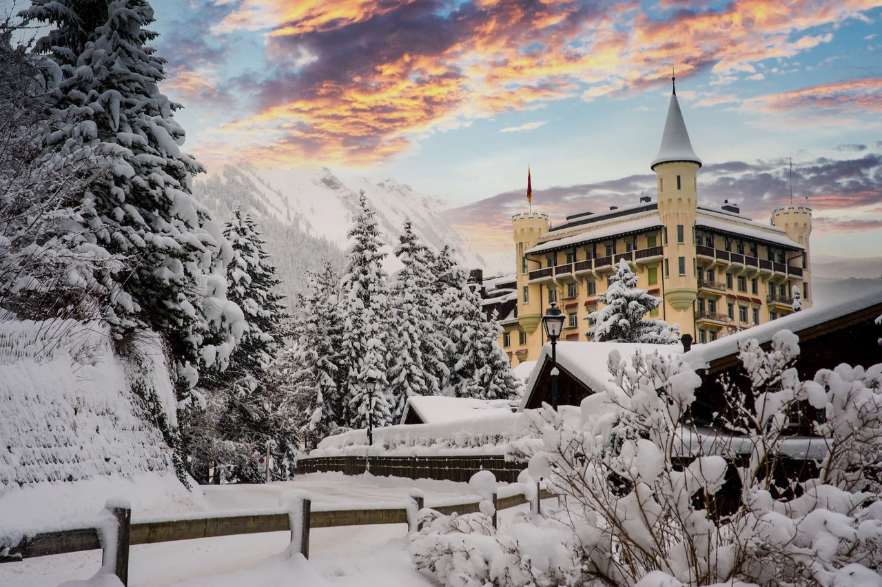 SNOW COVERED BUILDINGS AGAINST SKY