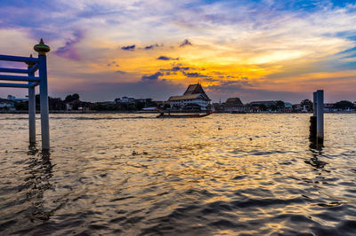 Scenic view of beach against sky during sunset