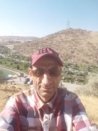 Man wearing sunglasses against clear sky