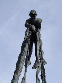 Low angle view of statue against sky