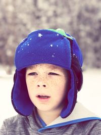 Close-up of boy in warm clothing during winter