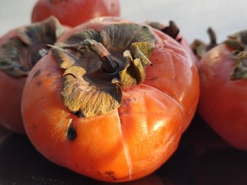 Close-up of pumpkins against orange background