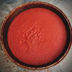 High angle view of red fruit in bowl on table