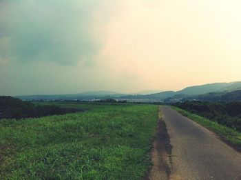 Country road on grassy field