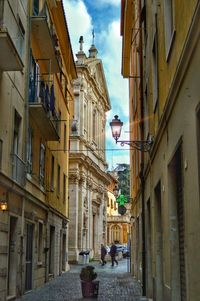 Narrow street amidst buildings in town