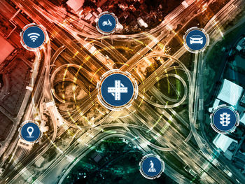 Digital composite image of illuminated street lights in city at night