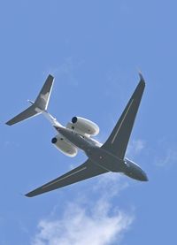 Low angle view of airplane flying in sky