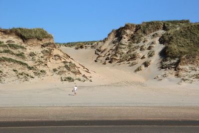 Scenic view of desert against clear sky