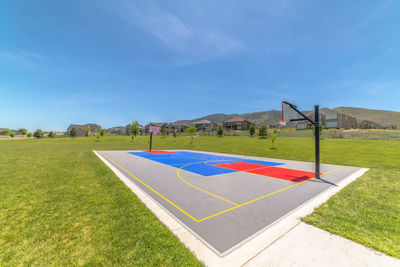 Scenic view of field against blue sky